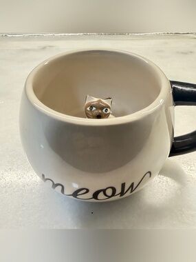 Cost Plus World Market Cream and Black Ceramic Cat Mug with Hidden Kitty